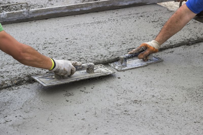 Professional Concrete Levelers at Work
